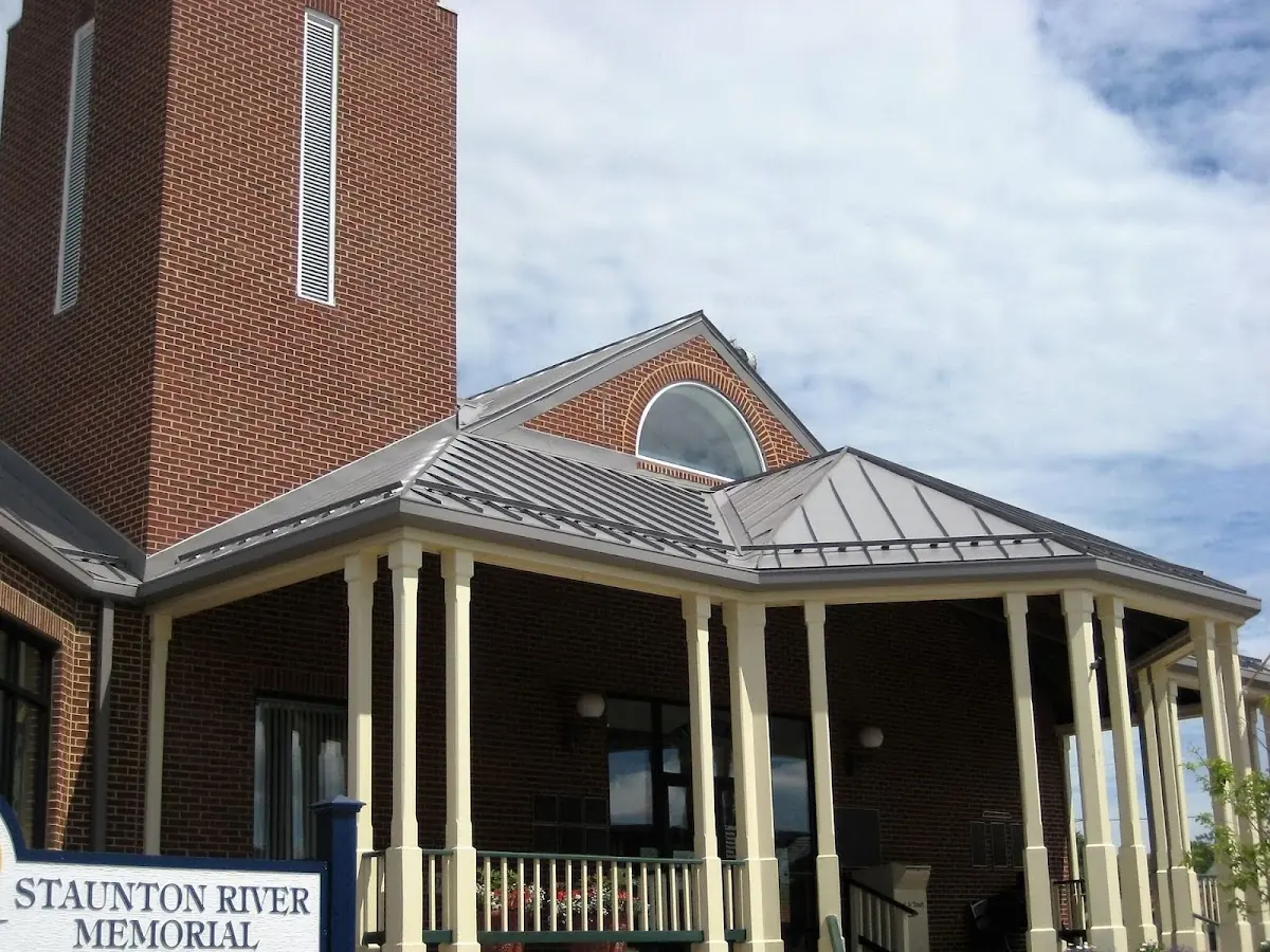 Skilled roofing craftsmen working on a residential roof in Lincoln-Villa